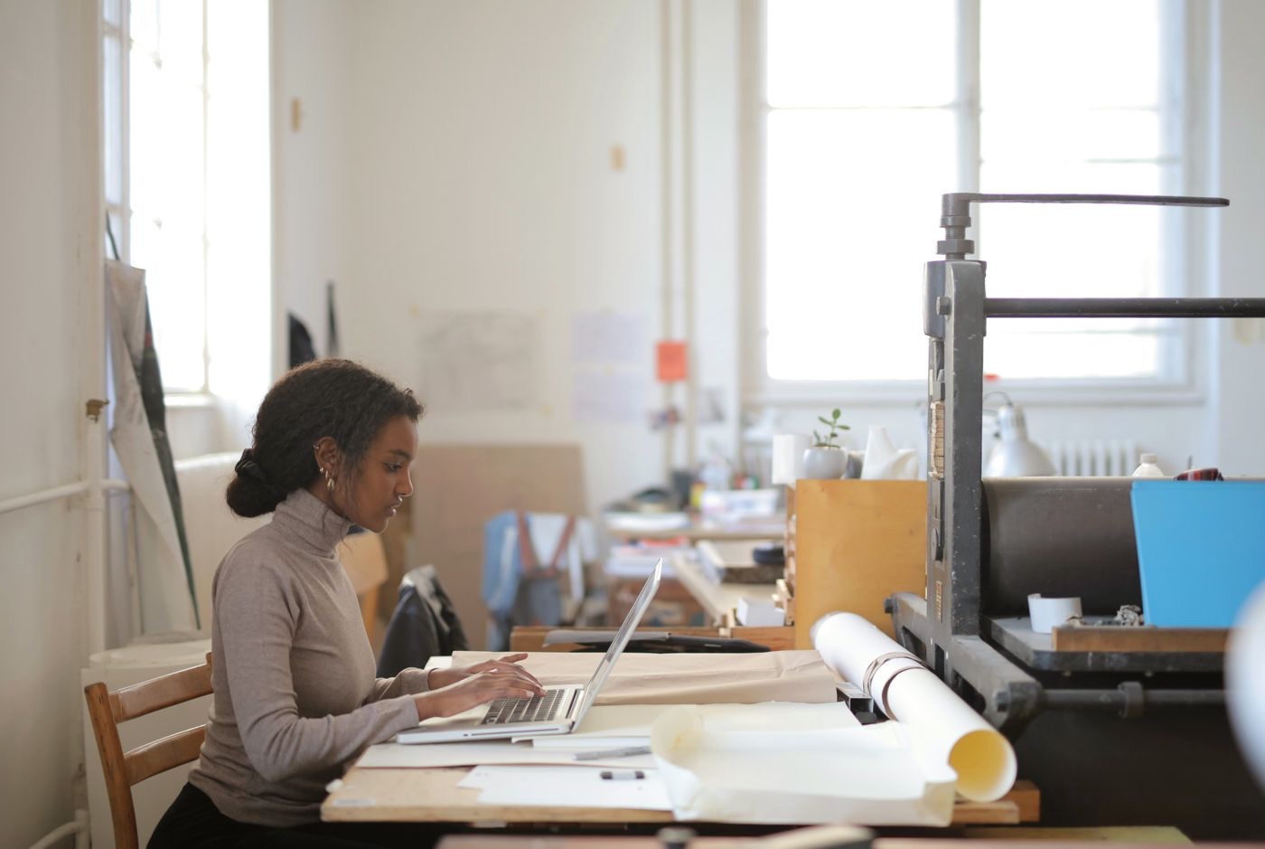 A founder getting her business found online, working on a laptop